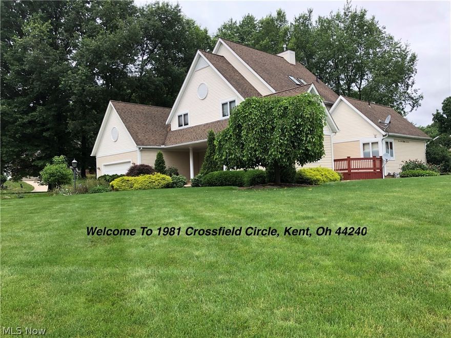 Dramatic roof lines and stately columns at the front entrance welcome you to 1981 Crossfield Circle, Kent, Oh. This lovely home is located on a corner of a Cul de Sac in desirable Willowridge. If you need or want to be minutes from KSU and bustling downtown Kent, this is it. This home was quality built from a Better Homes and Gardens design, built by Paino Construction, and was featured in local Parade of Homes in 1994. The spacious open floor plan is well lit with skylights. Special touches include a Vacuflo central vacuum cleaning system, security door locks, bidet that warms as you approach, 2 built-in desks on second floor-- could be designated as study/library at one and other as office, custom cabinetry, whole house humidifier, 6” exterior walls that provide extra heat and sound insulation, 20' ceilings in center great room, hardwood floors with walnut accents, walk in pantry off of kitchen, jacuzzi tub in master bath, 2 decks and a patio, Jack ’n Jill suite, water powered backup