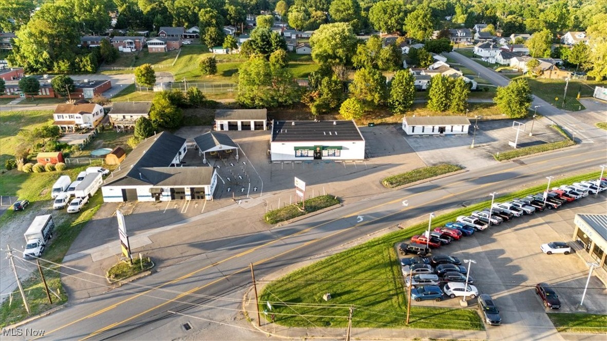 Updated Info - Sellers will entertain splitting parcels to sell buildings separately. Commercial Opportunities for this location are Endless. It was previously an Oil Change/Service facility including a fully automated car wash in the buildings to the left (approx 6,000 sq/ft) There is a (Approx 1,600 sq/ft) 3 stall garage with two auto lifts in the rear of the property. The building in the center is (approx5,600 sq/ft) That has a 4 stall garage with one auto lift in the rear of the building.
Front space of this building is being Leased to FSPT. The building to the right was used as a Pizza/Italian shop (aprox 1320 sq/ft)
There is Currently a lease with First Settlement Physical Therapy in the front of the center Building. Must sign an NDA to receive Information on Lease. All contents in the buildings will convey to purchaser, Excluding contents owned by FSPT. Pre Approved Buyers with Proof of Funds before all showings. Per Seller