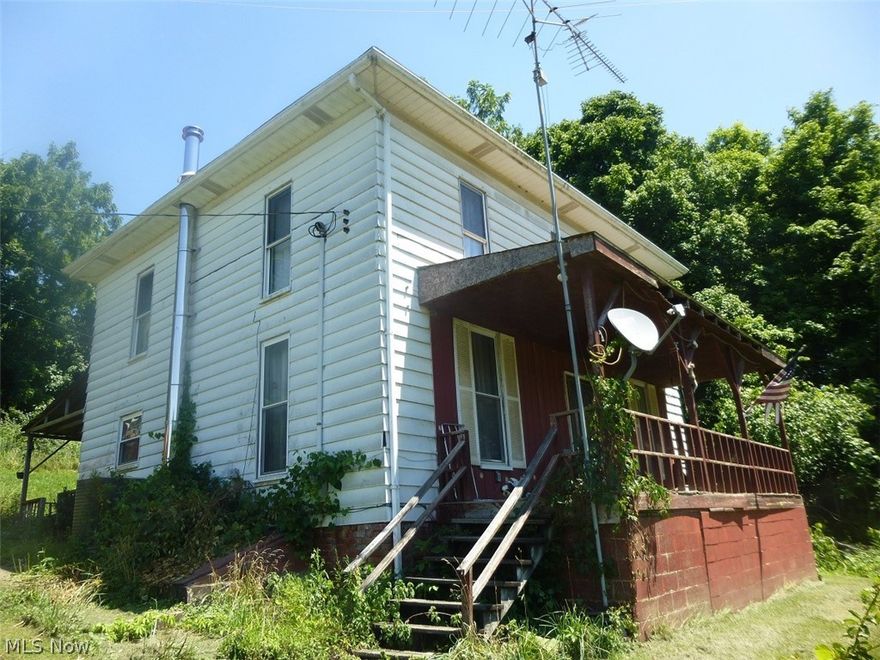 55.51 acre farm housing 4 family's at one time. Currently 1 family living in older 2 story farm house. Address of farm house is 7026.  Some repairs have been made. New oak stairway to 2nd floor and brand new ceramic bath on 2nd floor. 2 New aluminum chimneys. 1 is for an oil furnace and the other a wood burner. Farm house has a spring and older septic. Down the road a little on the left is 6925 and 6927. 1 is a 1992 double wide and the other a 1998 trailer. Both of these have spring water and 1500 septic systems with 900 feet of leaching. Down the road a little  more across the street is a double wide in poor shape. This also has a well and1500 gallon septic. This property was once a nice working farm. Property sits on both sides of the road and goes way back to the railroad tracts. Owner is selling  "AS IS" and does not want to do any water or sewage inspections so buyer will be responsible for these within 90 days of purchase.