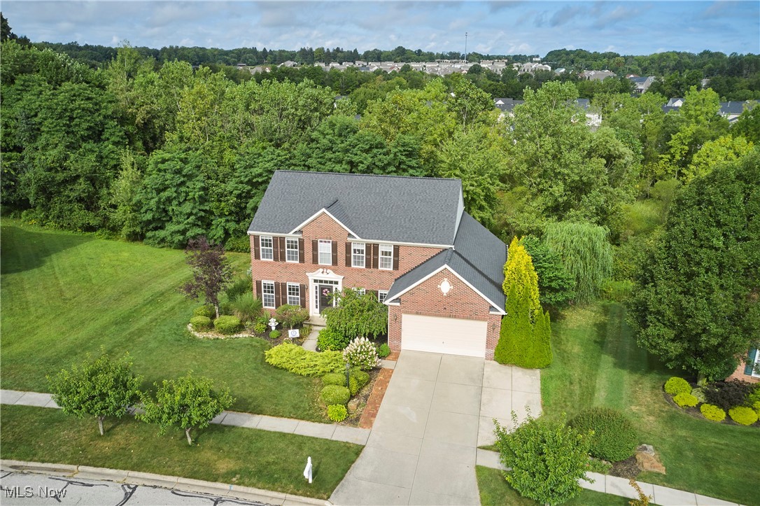 Welcome to this beautifully updated 4-bedroom, 3.5-bath home in the highly sought-after Hillside Estates neighborhood, located within the Award-Winning Revere School District. Recent updates include a new roof (2022), windows (2024), A/C (2025), and kitchen appliances (2025), plus fresh interior paint (2023) and updated light fixtures (2022–2025). The open floor plan features a kitchen that flows into the family room with a cozy fireplace, perfect for gatherings. Step outside to the large deck with a charming gazebo overlooking the neighborhood pond. The main level also offers a formal living room, formal dining room, laundry room, and half bath. Upstairs, the spacious owner’s suite is joined by three additional bedrooms and a full bath. The walkout lower level adds 800 sq. ft. of finished living space, complete with a rec room, full bath, and separate workshop area. Additional highlights include a 2-car garage with extra parking pad, and a fantastic location with easy access to the Montrose Shopping District, I-71, and I-77.