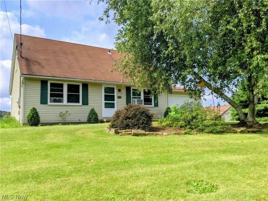 Cozy 3 bedroom bungalow conveniently located right in-between Orrville and Dalton. On the main floor, you'll find a living room, an eat-in kitchen with a deck right off the dining area, a master bedroom, and full bath. Upstairs, you'll find two additional bedrooms and a half bath. There is plenty of additional storage space in the partially finished basement which is complete with a family room and office. Enjoy the beautiful country setting from the back deck or the large porch on the 30'x40' outbuilding. The spacious outbuilding has a 2 car garage, office, and a wood burner. It could make an excellent workshop! This home has many new updates!