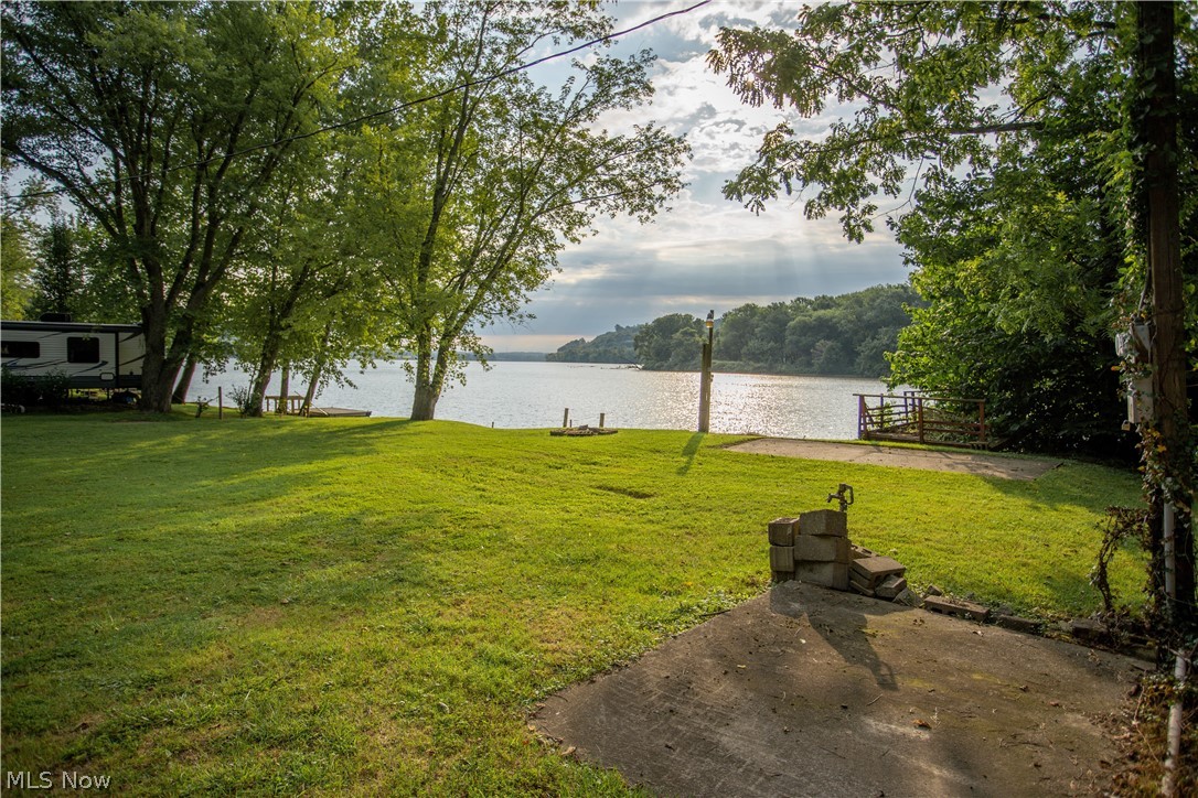 Not all river lots are created equal... allow me to show you what I mean.
Along the Ohio River and located between Hockingport and Little Hocking - there is this amazing little spot in the river that is so perfect, so magical, that you can hardly believe that it exists. Why do I say that this spot is magical? Not only does your lot come with one of the best views that I have ever seen, it is situated right across from Mustapha Island. Why does that matter? Because unlike all of your friends’ lots, there is absolutely NO barge traffic (the barges cross on the other side of the island) to spoil your view and disturb you with their wakes. Also unique to you, this property is located on a privately owned, dead end road so there is virtually no traffic to worry about either.
This listing is for Lot B, the next door neighbor of the “Shelter House” lot, is a little smaller, but is still its own slice of paradise. It includes full water and electric hookups, a concrete pad for your campe