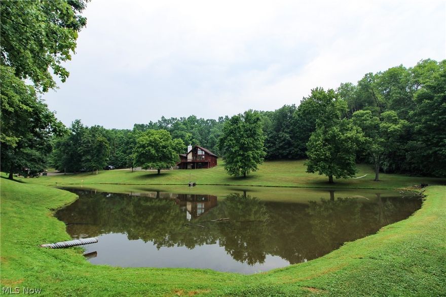 Mostly wooded 34.211 acres. Large stocked pond with dock. 3-bedroom, 2.5 bath cedar home. Kitchen with bar & marble counter-tops. Finished walkout basement with possible mother in-law suite. Concrete patio. Fireplace on each floor. Hardwood flooring throughout. Large deck front and back of home. Geothermal heating and cooling. Views from all the large windows around the home. Taxes are $2003.04.