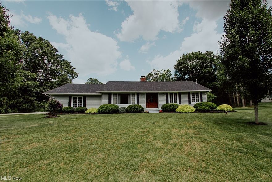 Looking for your own Personal Paradise?  Look no further than this meticulously cared for Ranch in the heart of Montville Township!  The curved driveway leads to this 3 Bedroom, 2 Full Bath home, that’s nestled on 3 Beautiful Acres!  An upgraded Front Door with sidelights welcomes you into the Foyer.  French Doors open into the Living Room with Crown Molding, Chair Rail, and a Picture Window to the Front. Luxury Vinyl Plank Flooring is seamless through the hallway into the Bedrooms, Renovated Baths, and into the Family Room, which is complete with a cozy Woodburning Fireplace and Beams overhead. This opens into the Eat-In Kitchen with Newer Cherry Cabinetry, All Appliances, Crown Molding and a Tile Backsplash.  The Family Room also opens to the Enclosed Back Porch via sliding doors, which is the Perfect place to relax and enjoy the back half of this amazing property! From here is a nice sized Fenced in Area for pets or children to roam without worry, and beyond the fence is a dream – O