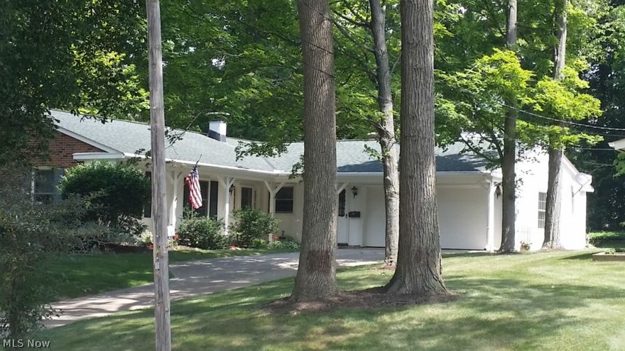 Conventional Ranch w/3 Bedroom 2 Bath w/Summer Porch & perennial gardens.. so inviting. Highlights include: a cozy front porch,  an open Oak Kitchen w/Hearth Room [Living Room] all appliances stay. Great Room with wall of windows to the stunning screened-in Summer Porch w/nature stone flooring, beautiful wooded, landscaped backdrop with newer Anderson windows throughout [2010]. Roof 04, furnace 08, H20 14, new garage floor & overhead storage w/electric box upgraded. Sand Beach community in a Award Winning Aurora School District, with easy access to I422, I480, I271, Akron, Youngstown and Cleveland in 30 minutes.