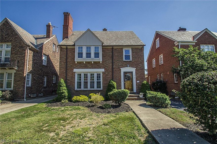 Beautiful all brick stately colonial on a peaceful, quiet, and family friendly street. This 4 bedroom, 2.5 bathroom home is the perfect mix of old world charm and today's updates. Lovely hardwood lines the floors. The living room boasts a cozy fireplace and large picture window that floods the first floor with natural light. Enjoy the three seasons sitting room, open the sliding glass doors that lead out to the attached deck, perfect for Summer and Fall evenings. Large eat-in kitchen with updated tile floors, neutral cabinets, and counter tops. The second floor has three bedrooms accompanied by a full bathroom, and the third floor is a large owners suite with private full bathroom and outdoor balcony. Newly B-Dry waterproofed basement has sump pump, additional fireplace, glass block windows, the perfect family room or man-cave is awaiting your personal touches. Newer windows. Newly built 2 car garage. Fresh paint throughout. Upgraded electrical. Whole house alarm system for your safety