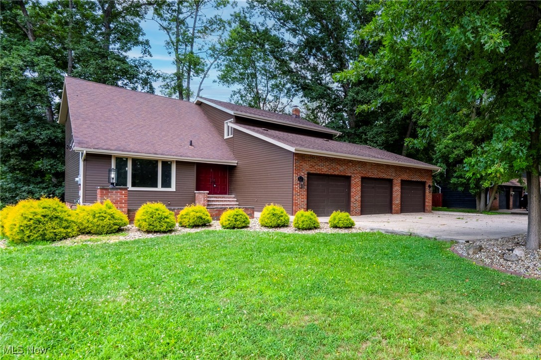 Step into this beautifully updated home blends mid-century modern charm with contemporary comfort. The open layout features a grand foyer, a brand-new eat-in kitchen, and formal living and dining rooms with fresh paint and flooring.
Enjoy the cozy family room with a wet bar and wood-burning fireplace insert, plus easy access to the deck for seamless indoor-outdoor living. A spacious first-floor office offers a quiet workspace.
Upstairs, the 17x13 ft. primary suite includes a full en-suite bath, with three additional bedrooms and a stylish hall bath. The finished basement adds a 40x14 ft. rec room, full bath, and ample storage.
Outside, a paver patio, heated 3-car garage, and a deep backyard with a creek and bridge complete this inviting retreat.