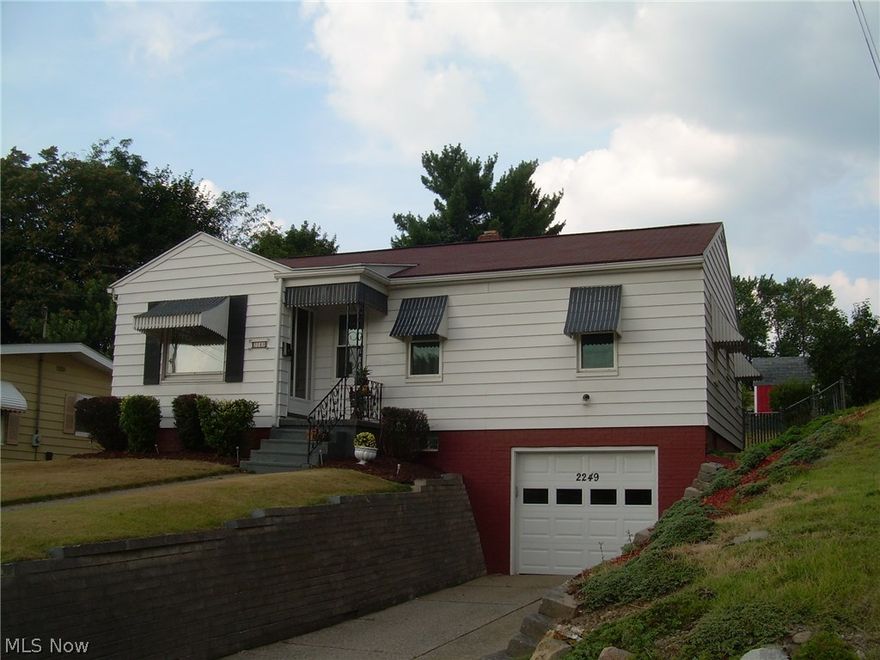 An absolute pleasure to show this 3 bedroom ranch. Is gorgeous both inside and out!  2249 E. Market St. sets in nicely in Akron/Ellet and features easy one floor living, a beautiful decor, clean as a whistle! Newer windows. Awesome enclosed back patio, formal dining room,  2 updated full baths, applianced and updated kitchen (with dishwasher), finished rec room in basement, glass block windows, attached garage, central air, washer, dryer, fenced backyard and a Home Warranty!  Call today to see this wonderful home!