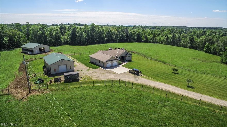 Mini Farm with 11 acres almost all pasture with good fence. 3 bedroom, 2 bath open concept home with pecan kitchen and stainless steel appliances. Large living room with woodburning fireplace. Free gas and minerals transfer. Beautiful views from the covered back porch. 2 barns with water (30x52 and 42x56)