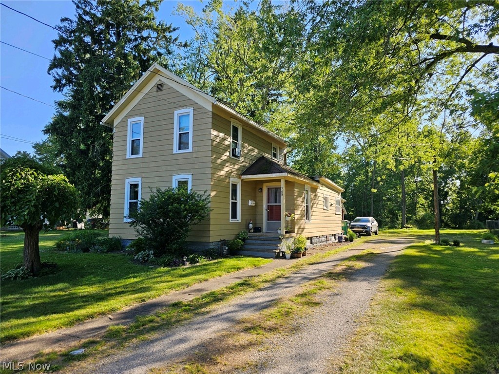 Discover this remarkable property featuring a beautiful 1.71 acre yard, ideal for embracing the outdoors and finding peace. Step inside this inviting home with its warm wood floors throughout, showcasing a charmiing master bedroom, full bathroom, and a convenient laundry room all on the first floor. Additionally, there is a separate building that could serve as a one bedroom in-law/teen suite or party room, complete with a kitchenette and bathroom. This extra space provides plenty of room to accommodate all your needs.