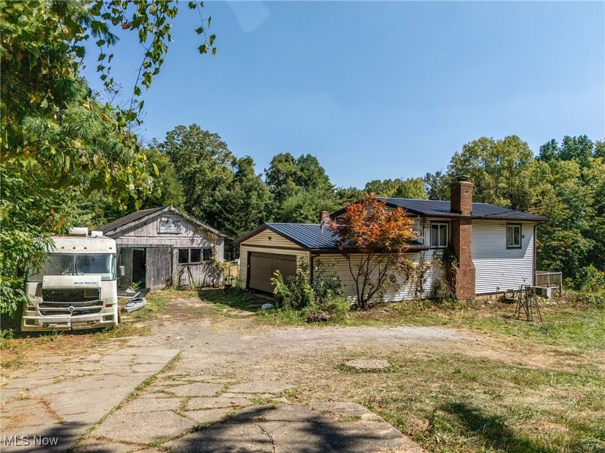 AUCTION DATE: TUESDAY, October 21st, 2025 AT 5:30PM. You can preview this home/property at this OPEN HOUSE DATEs: 09/21/25 - 4:00-5:30pm, 10/19/25 - 1:00-2:30pm and Auction day 10/21/25 at 4:00pm. Welcome to this 4-bedroom, 2-bath split-level home situated on 10.74 acres in Canton Township. Built in 1960, the residence offers approximately 1,586 sq. ft. of living space with a full basement and a 2-car attached garage. The interior features a spacious living room, an open dining area, a functional kitchen, and a mix of practical design and classic style. The acreage provides room for outdoor use, recreation, gardening, and potential agricultural or outbuilding opportunities. With its combination of land, existing structures, and established utilities, the property presents flexibility for a variety of future uses. Seller reserves the right to accept a pre-auction offer prior to auction day. Any inspections desired by a buyer are to be completed prior to fully executed purchase contract at buyer's expense. Property Sold Where Is-As Is..