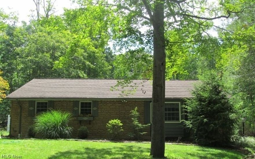 Be first or be sorry. Turn the key and move in. Pride of ownership here. 3 bedroom 1.5 bath brick ranch features 3 car garage and 2 fireplaces on over and acre and a half of beautiful land. Updated eat in kitchen with granite tops, stainless steel appliances and pantry. Living room and dining area wood parquet flooring. Living room also features Lopi wood burning fireplace. Gorgeous hardwood floors in bedrooms. Updated bathrooms. Full basement boasts recreation room with fireplace, large laundry room, workout room, 2 bonus rooms and closets for incredible storage. Circle driveway. Backyard features brick paver patio and heavily wooded area to enjoy the nature. 1 year HMS Home Warranty.