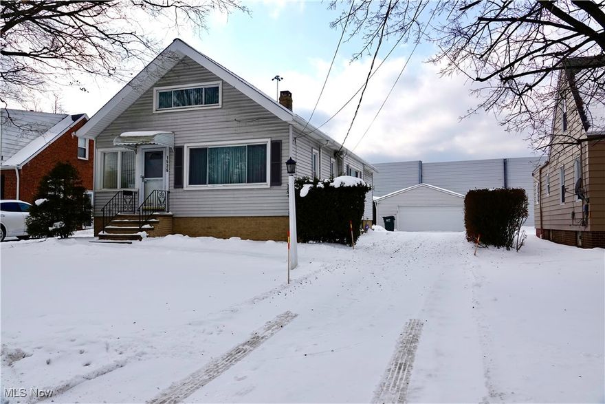 Welcome to this well maintained 2/3 bedroom bungalow. Spacious living and dining room. Eat-in-kitchen. 2nd floor master with plenty of closets/storage. A 2 car detached garage, updated windows, furnace, and central air. Show and sell!!