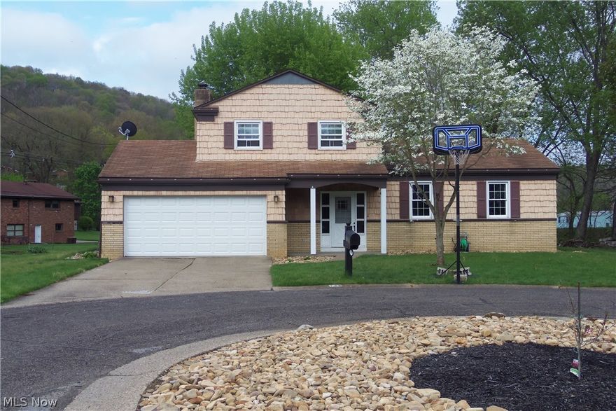 GET IN TOUCH WITH NATURE!  You will find a perfect escape sitting on the banks of the creek, either fishing or watching the sun rise or set, of this 3 BR, 1.5 bath home in Country Club Estates. Comfortable family room with fireplace, updated kitchen and BR's with hardwood flooring. Covered patio overlooking the large back yard, remodeled baths, central air and 2 car garage.