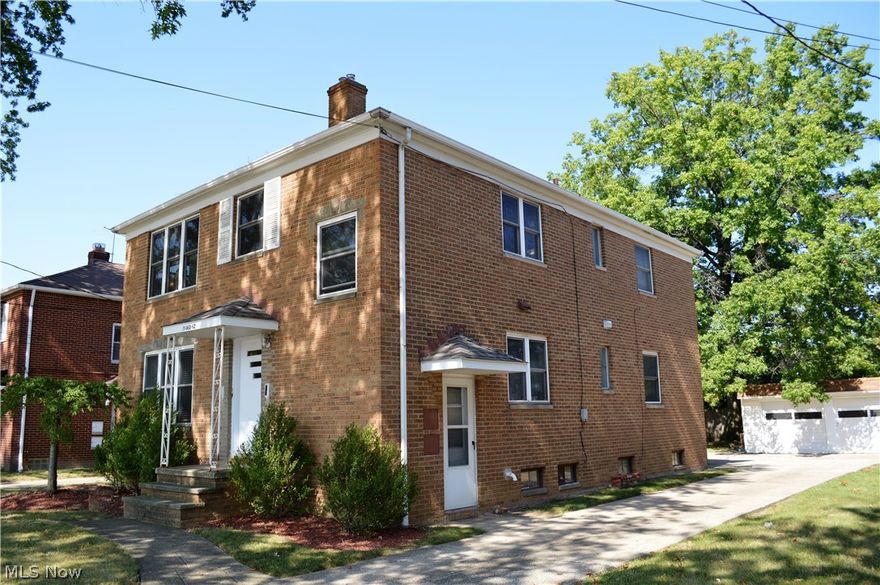 This nicely maintained brick two-family is located in a prime Rocky River location, with award winning schools.  The property features two identical units each with 2 bedrooms and 1 full bath, divided basement, 2 new furnaces, new A/C unit, newer roof, newer double pane windows, lots of storage, 2 back porches, a detached 2 car garage, and a huge concrete pad for parking and convenient turn-arounds.  All appliances stay.  The upstairs unit features hardwood floors throughout with carpeting in the hallways and bedrooms, tiled bathroom floor and laminate kitchen floor.  The downstairs unit has exposed hardwood floors in all the rooms except the kitchen and bath, which have tile flooring and laminate.  Separate utilities.  Perfect opportunity for the owner/occupant to live in one unit and rent the second, or as a solid investment property.  Make an appointment today.