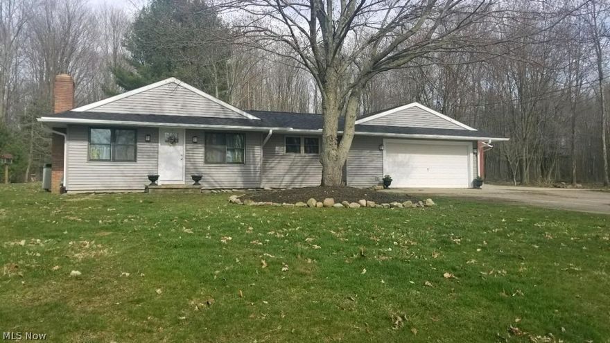 Come living out in Roaming shores in this 3 bedroom 2 bath ranch and feel like you are on vacation year round!!!!  This home has been completely remodeled down to the studs. New drywall, plumbing, electric, roof, gutters, siding, doors, flooring and 2 brand new bathrooms. You have an open floor plan with eat in kitchen and living room with cathedral ceilings and wood burning fireplace. Master bedroom  with master bath. 2 car attached garage and  if this isn't enough there is an extra 3 car detached garage with complete apartment or in law suite attached with living  room, kitchen, full bath and bedroom. Great for those overnight guest  if you are entertaining for the weekend and boating  and fishing on the lake or just relaxing and having a fire and picnic in your backyard that is on 3 lots totaling just under on acre. This is a must see!!!!!!