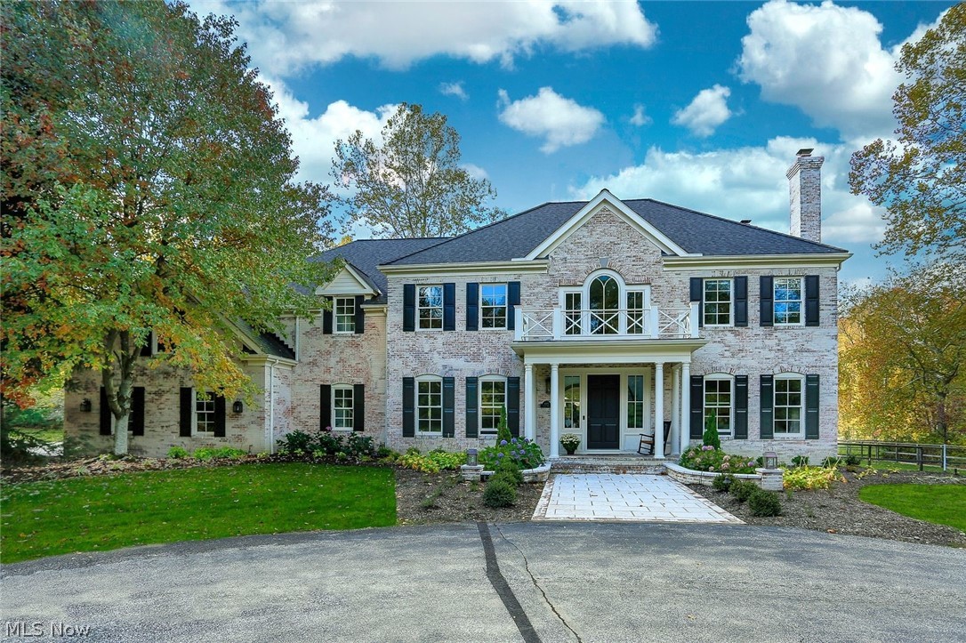 Located in Chagrin Township, this home is walking distance to town and has a wonderful trail to the scenic river. On just under 5 private acres, this home and property has been entirely renovated from top to bottom in the past 2 years using only high end finishes. The front entry opens to a traditional layout while the back of the house has been redesigned for current style living with an entirely open concept. The kitchen has only the finest materials and finishes including upscale appliances (range, 2 d/w, steam conv oven, warm. drawer, built in subzero fridge/freezer), fabulous range hood, library style ladder enabling access to extensive storage, custom iron pot racks and pulls, many windows and fabulous views. Fam room has hidden tv panels over fireplace. Upstairs is 5 bdrms - owner suite w his/hers walk in closets, balcony overlooking yard. Bath has shower and tub, heated marble floors, his/hers vanities w marble counters. One bdrm has private bath, 2 more share bath. At end of h