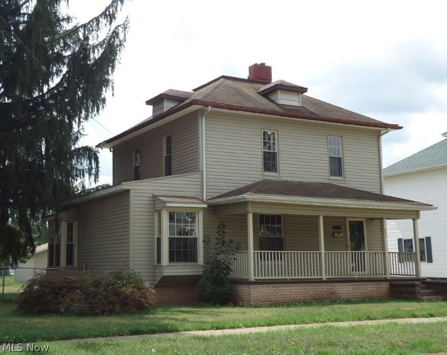 Spacious floor plan has large living room off open staircase foyer. Beautiful original woodwork in much of the home. Oversized dining room with bay window seat and custom bookshelves/display cabinet. Dining room area could be divided into two rooms with furnishings. A very nice area of the house. Built-in china cabinets in dining room and kitchen. Neutral carpet. Updated oak kitchen/ample storage. Mud and laundry room off kitchen at convenient back door entrance. Three bedrooms (one bedroom is a walk-thru). Third bedroom would make a great nursery, office, walk-in clost or reading getaway. New upstairs bathroom. All new plumbing and soil pipe. Brand new H2O heater and furnace. Central air easily added. Full basement has a bath with large tub. New drainage around house/driveway concrete. Fantastic 4-car garage space. Majority of yard fenced. Vinyl siding, replacement windows update this nice home near schools. Move-in condition. Compare!