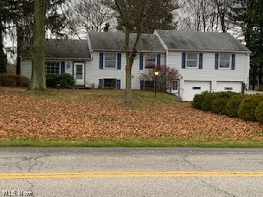 Do not let this one pass you by!  This one has plenty of space including a potential in-law suite with a kitchen!  Large lot with a partially fenced in yard.  Two car attached garage as well as shed for storage.  Eat in kitchen, living room w/ a fireplace, family room w/ a fireplace, half bath and laundry room on the first floor.  Located above the 2 car garage is an additional living suite with a kitchenette, living area, a bedroom, full bath and an enclosed porch. This area can be accessed directly from the outside or from the home. Call today.  This one is priced to move.