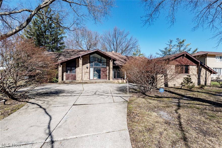Striking contemporary cape cod with an in-ground pool in Shaker Heights! This exceptional home provides 4,246 square feet of living space with a welcoming floorplan and a backyard oasis. It is just waiting for your finishing touches. Original marble floors greet you in the two story foyer, where large windows provide natural light. The formal dining room features hardwood floors that flow into the eat-in kitchen. The spacious family room includes a wood-burning fireplace, a wet bar, and a beamed ceiling. A living room, the first floor master suite, a laundry room, and a half bathroom complete the first floor. Upstairs, you will find four bedrooms and two full bathrooms. The full lower level is partially finished with a large rec room, and there is plenty of space for storage on the unfinished side. Outside, you are sure to enjoy summer gatherings in your own backyard oasis, which includes a patio, in-ground pool, and poolhouse with a kitchenette and full bathroom. Recent improvements include a newer water heater. Located just off of S. Woodland, this home is minutes away from area retail destinations and parks, very convenient to area highways.