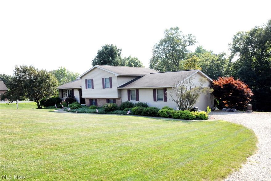 Nice 3 bedroom, 3 bath immaculate tri-level situated on just over one private acre on the edge of New Concord. Cozy fireplace in family room. 2 car garage.