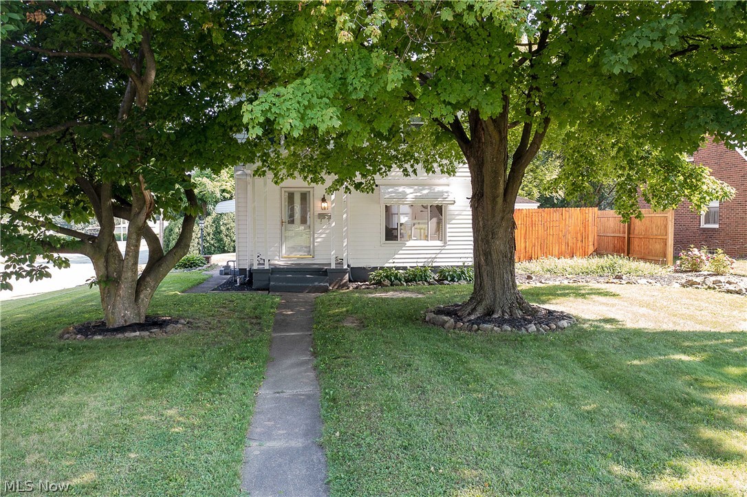 Check out this adorable two-story well-cared-for home on Vincent Blvd, Alliance. As you enter this home, you will love the bright and spacious living with a wood-burning fireplace (bricks surround) and a picture window overlooking the front yard. The dining room is open to the living room with an easy flow to the kitchen and sliders to the lovely, private, and relaxing deck. The kitchen offers plenty of cabinet storage, tiles backsplash, appliances, and laminate flooring. The upper level has three bedrooms (two with new carpet 2020) and a completely updated full bathroom with a walk-in shower (2020). The partially finished basement has a recreation room/family room with a barn door that opens to the utility room/laundry room and half bath (it could be a full bath). Some updates include new countertops and installed a new sink in the kitchen (2020). Painted house exterior and the garage. Repaired and stained deck. Fixed heating ducts in basement. New wiring in the basement. Installed sl