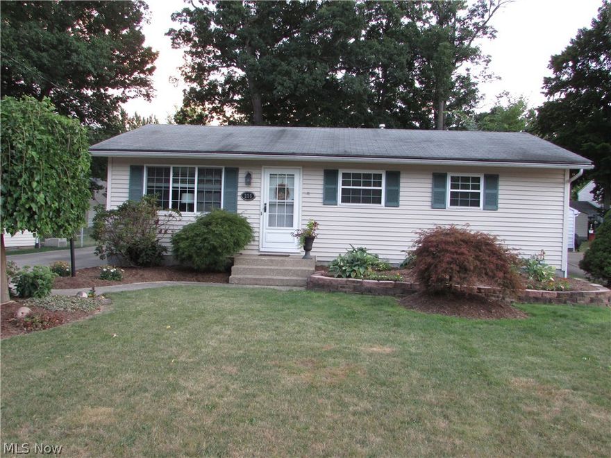 Do not miss this 3, possible 4, bedroom ranch in Munroe Falls.  This home has the customary main bath, a 1/2 bath off of the master bedroom, and a spa bath that includes an oversized whirlpool tub, large stand up shower, and sink... and has a nature stone floor.  The finished basement has a 20x16 family/rec room with new carpet, and a 14x11 office or 4th bedroom.  The eat in kitchen has been updated.  The scenic rear yard features a deck, patio, koi pond, and amazing plant life.  This home features a 2 1/2 car garage, large living room, hard wood floors, a newer hot water tank, and so much more.