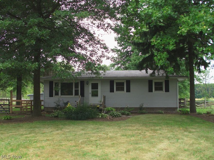 Bring your horses! This is a fabulous opportunity to own a well maintained ranch home and 4 stall horse barn on over 4 acres! Beautiful hardwood floors and neutral paint colors throughout. Gorgeous wall of stone fireplace is the focal point of large living room. The updated kitchen offers stainless steel appliances and expansive cabinet storage. The sliding doors off the formal dining room lead out onto the covered deck with ramp. Full basement with washer, dryer, laundry sink and additional shelved storage areas. Horse barn has electric and water plus 2 stall mats. 2 acres of fenced pasture and 2 acres of woods offer great potential for trail riding. Cement floor in front barn area doubles as a 2.5 car garage with openers and lawn equipment storage. Updates include roof, furnace, AC, windows, sliding doors, appliances, shed and much more!