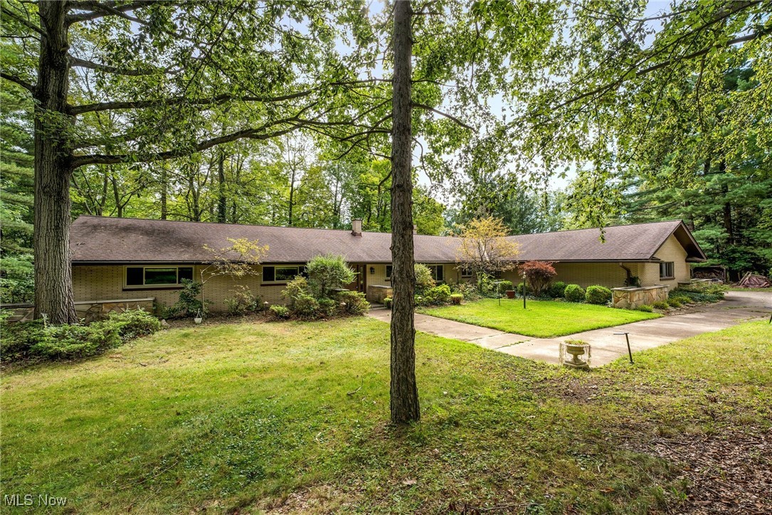 Welcome to 3929 Humphrey Rd in Richfield, a beautifully maintained brick home offering 4 bedrooms, 2 bathrooms, and 2,958 square feet of comfortable living space. Perfectly blending charm and functionality, this property sits on a picturesque lot with a pond, a 900 sq. ft. barn, and 3 spacious patios, one with a built-in grill and brick enclosure, ideal for creating an outdoor kitchen or entertaining area, and the other 2 are perfect for sitting and relaxing. Inside, the expansive kitchen is the heart of the home, featuring stainless steel appliances, dual sinks, and plenty of space for cooking and gathering. Just off the kitchen, you’ll find both a cozy dining nook and a formal dining/living room combination with French doors that open to the patio, filling the home with natural light and offering seamless indoor-outdoor living. A sunroom adds extra versatility, while the family room provides a warm retreat with its inviting fireplace. The bedrooms are comfortable and inviting, while the bathrooms are well maintained. A chic laundry room with built-in cabinetry adds convenience and style. With an attached 2-car garage and plenty of storage, this home offers space inside and out, making it a unique opportunity in desirable Richfield.