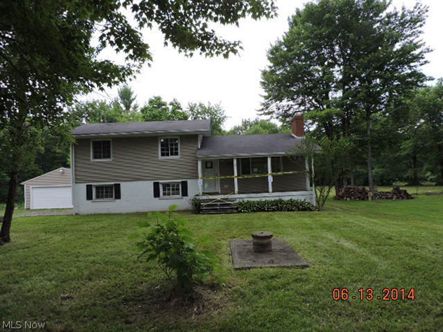Country living in this spacious bi level home with partial basement. Oversized 2 c detached garage, modern kitchen and approx. 2acres of land. City water with septic, gravel drive, and rear deck overlooking wooded lot. o The purchaser must be buying the home as their primary residence during the initial 20 days of listing, without competition from investors. This property is eligible under the Freddie Mac First Look Initiative through 07/20/2014  All sales are subject to the filing of FC deed and clear title. Acreage is M/L and subject to FC deed including both parcels. Basement had previous water infiltration. Sold as is. Buyer will be responsible to comply with TCBOH septic test, repairs, upgrades or replacement.