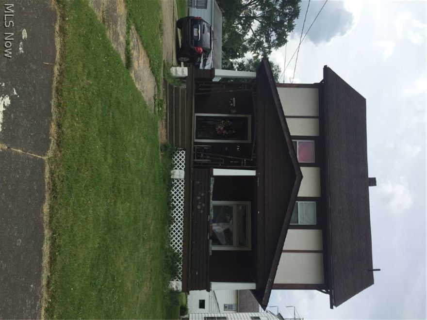 Looking for a fixer upper?  This is it!  Large 3-4 bedroom home features some newer windows,  It was once a duplex and could be converted back.  There is a kitchen on the second floor.  The extra deep 2.5 car garage would be great for the car enthusiast!  This home needs some cosmetic work but with the spacious design and the natural light that come in from plenty of  windows it will make someone willing to put the work in a lovely home!