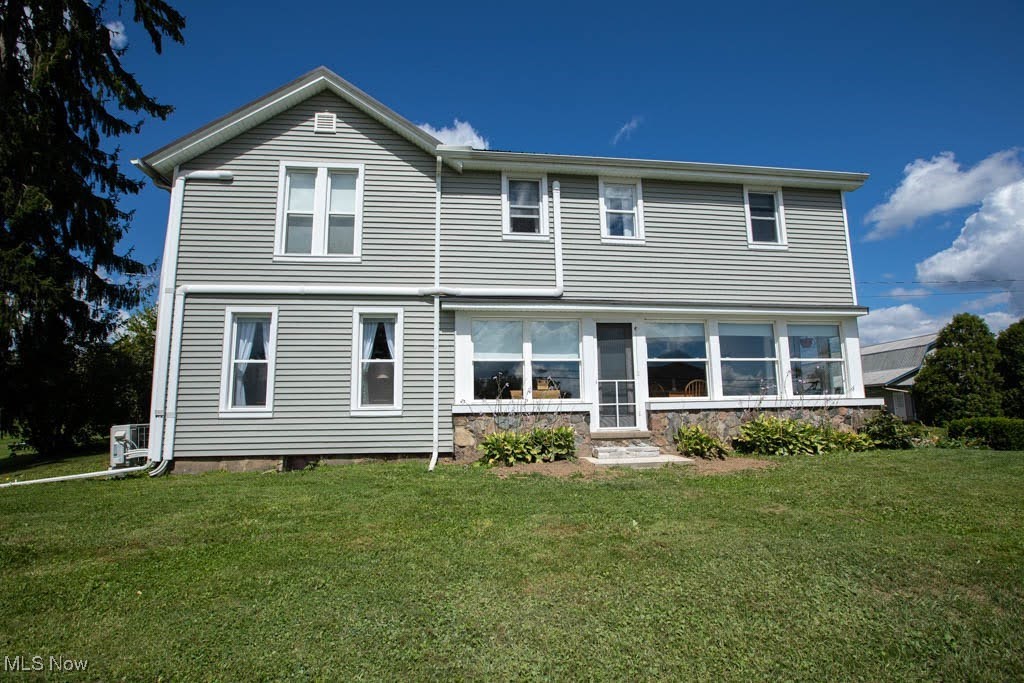 Green acres is the place for you! Experience country living at its finest and make your new home this exceptionally well remodeled country colonial situated off of one of the most scenic rolling hills areas and prettiest streets in all Geauga County. This amazing home has a fabulous country kitchen with custom made cabinetry with a huge center island and SS appliances. All hardwood floors flowing seamlessly in the adjacent morning room area and into the cozy living room. A wide open floor plan continues into the huge back entry mud room that encompasses so many possible uses, laundry area is located here. Now into the back sunroom that could double as a recreation room to gather and hang out with family and friends (2) warm wood stoves help to head the area. The home has forced air, however, utilizes mini split heating and cooling units as well. Upstairs we go find 3 large bedrooms with good closet space and a full bath that is nostalgically unique and much time and money spent here and thought for this incredible home. Outside a huge outbuilding (36x50) 2 large garage doors could hold many cars and toys. Barn and 2 sheds and chicken coop as well. Close to Kent State University Geauga campus as well as The new Berkshire High School and located minutes from Middlefield four convenient shopping another necessity needs.