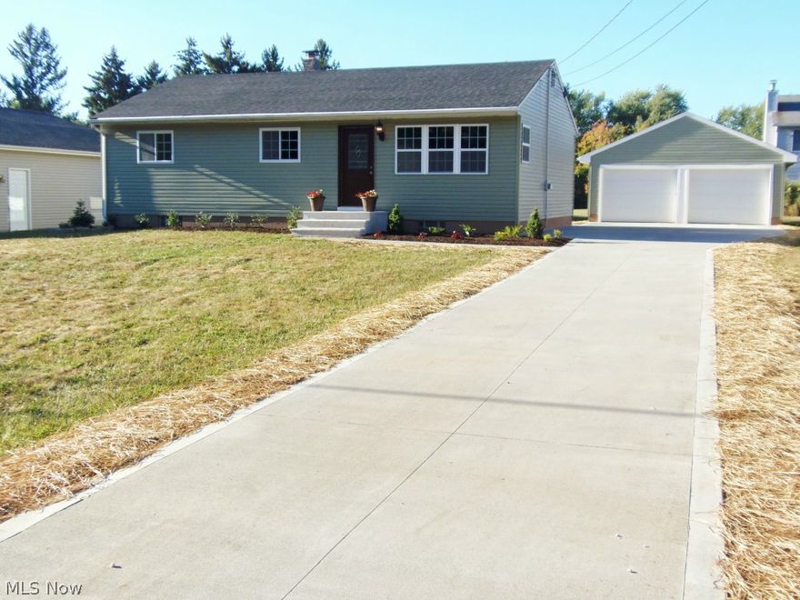 Practically a New Home. Everything New in 2015 including roof(35 year 3 dimensional shingle) gutters and downspouts,, vinyl siding, windows (vinyl double paned)  Cherry Kitchen, Granite counter tops, Tiled glass backsplash, stainless steel range,microwave,refrigerator, wood laminate flooring, remolded bath with ceramic flooring, furnace,Central air,and Hot water tank. Glass block in basement.Also insulated. New concrete Drive,porch, patio and garage floor. New carpet and freshly tastefully painted. All new sidling fans with remotes professionally landscaped.All new interior and exterior doors included the Garage. Check out the new crown moulding through out the entire home. Waterproofed basement.  All that since January 2015. Won't last!!