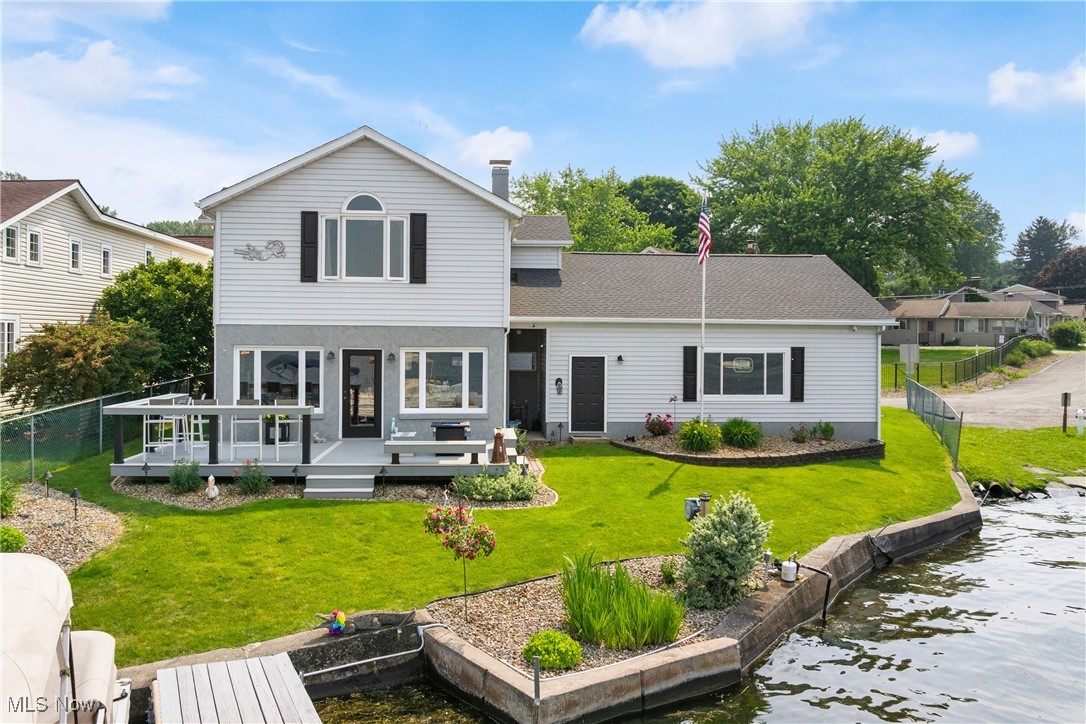 PORTAGE LAKES Lakefront Perfection w/Glorious Lake View(s) Awaits in this "Well Cared for & Superbly Updated Lakefront Home" 2 Boat Docks is a rarity on the "Main Chain of Portage Lakes" you can SKI, SAIL, FISH, SWIM, MORE *Exceptional Decor throughout w/Gleaming Hickory-Wood Flooring and a "Vacation-Like Lake View" Greets you, as soon as you step through the front door into the Large Foyer *The 1st floor offers A Very Open Floor Plan: A Large Dining Area w/a Stunning Lake View from your Dining Table, A Vaulted & Exceptionally Beautiful Living Room w/Multi-Windows showing off A Panoramic Lakefront View of Turkeyfoot Lake & a lovely door out to the Custom Design Composite Decking that offers plentiful built-in Seating, a Countertop Bar, Beautiful Firepit & More* A Beautifully Updated Kitchen w/plentiful cabinetry boasting Don Drumm Hardware, Underneath Lighting & Rich Granite Countertops + Stainless appliances* A Glamorous 1st Floor Full Bathroom w/a Walk-in shower, A Roomy 1st Floor Laundry/Utility Room + Washer & Dryer that Stay *The Jumbo-Vaulted Master Suite Boasts An Amazing Lakefront View, A Roomy Walk-In Closet and A New Master Bathroom w/ Heated Flooring and A massive Walk-In Shower w/both Rain-Shower & Hand-Held shower heads *2 more Large Bedrooms w/ New Luxury Flooring and a beautifully Updated Full Bathroom *The 2+ Oversized Garage w/a Fabulous Lakefront View is Fully Insulated & Heated w/a pull-down stairway for xtra storage + a conveniently located urinal & sink* WOW All This And Parking for 6+ Cars *The Well/Septic Point Of Sale is done *Ask For the LIST of Primo UPDATES such as: newer Furnace, On-Demand water softener & Tankless water heater and much more *This Exceptional Lakefront Location offers rare pleasures such as: Watching Sailboats & Swans, Fishing & Boating from your own Dock(s), while enjoying Local food & entertainment from the Local establishment **The Boat Lift & Pontoon Boat + Most Furninshings, ETC. Can Be Purchased Seperately**