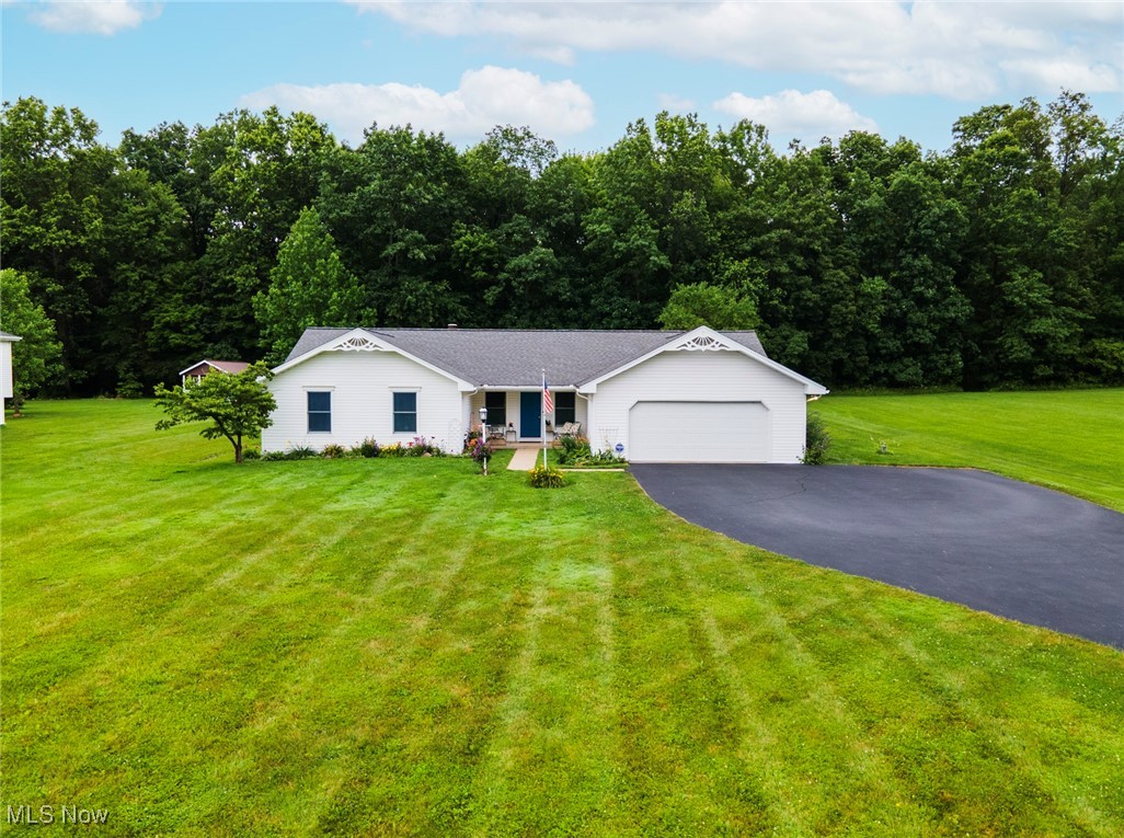 Welcome to Your Dream Ranch in Crestview Schools! Step into bright charm and everyday comfort with this lovingly maintained one-owner ranch, nestled on a beautifully flat 1-acre lot in the highly sought-after Crestview School District. Built in 1995, this sprawling 3-bedroom, 2.5-bath home offers a harmonious blend of space, light, and livability—perfect for growing families or those craving peaceful, open living. The heart of the home is the primary living room, where soaring cathedral ceilings, a cozy fireplace, and elegant French doors invite you to step out onto the backyard patio—creating a seamless indoor-outdoor connection for relaxing or entertaining. The generously sized primary suite is a true retreat with its own private full bath and a spacious walk-in closet. Two additional bedrooms are tucked away for privacy, while the conveniently located half bath is ideal for guests near the welcoming secondary living room, first-floor laundry, and attached 2-car garage entrance. Gleaming solid hardwood floors flow throughout the main living areas and primary bedroom, adding warmth and elegance. The eat-in kitchen is designed for everyday functionality and casual meals. Step outside to your very own backyard oasis—a lush, landscaped haven with a concrete patio perfect for sunny afternoons, outdoor dining, or quiet morning coffee. A massive shed with a concrete floor provides ample space for hobbies, tools, or seasonal storage.With well-maintained mechanical systems and thoughtful care from its original owners, this home is not just a house—it's a lifestyle waiting to be embraced. Don’t miss your chance to own this beautiful ranch in a location that truly has it all. Schedule your private tour today and experience the magic for yourself!