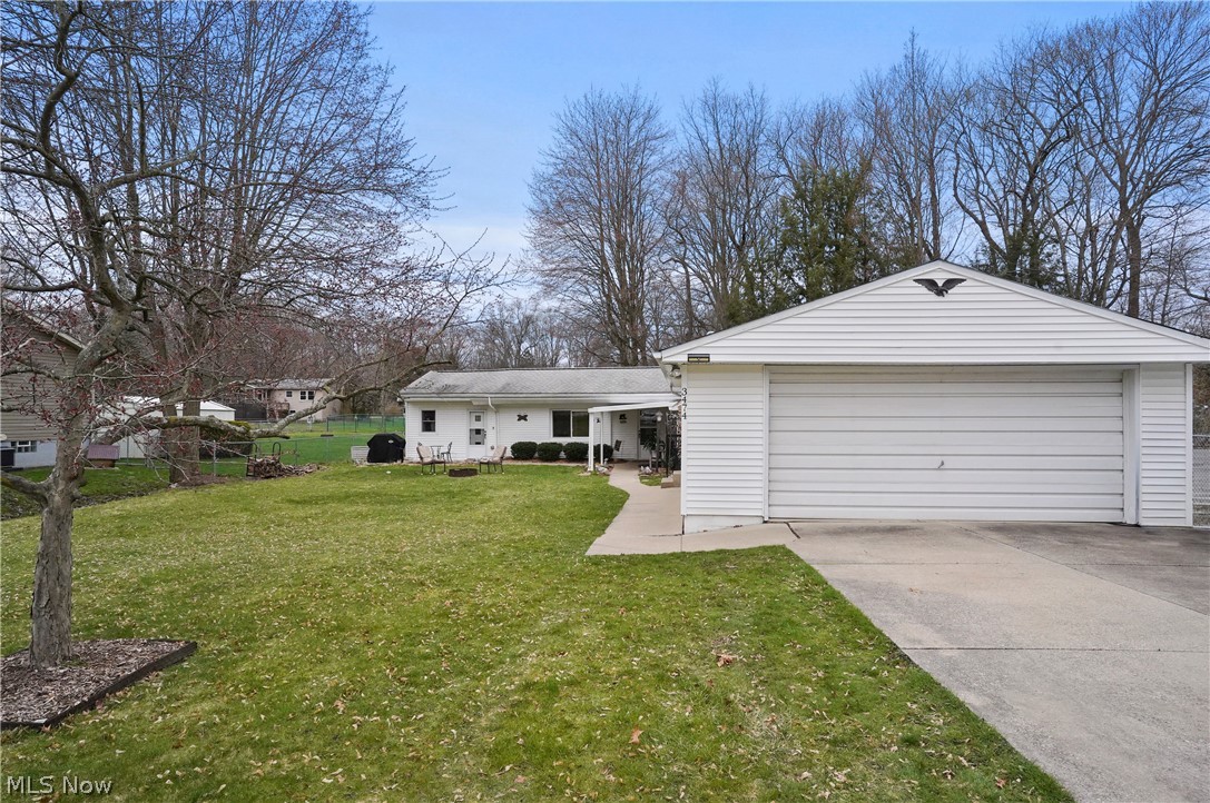 Welcome to this three bedroom ranch with spacious living room, kitchen with a cute eating area and bonus room perfect for a seating area or home office. The first floor is completed with two bedrooms, a full bath and a large laundry area. Upstairs you will find the third bedroom. Large front yard with oversized two-car garage and double-wide driveway for extra parking. Updates include a new furnace in 2018, air conditioning in 2019, and hot water tank in 2020. Schedule your private showing today!