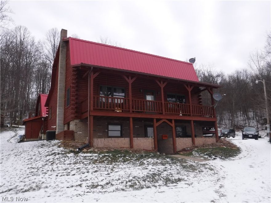 If you want a quality, private, 40 acre retreat log home ...this is it!  This modern Cape Cod log home features  new roof on house and garage, 3 bed. 2 full baths, 2 kitchens, living room and bonus room in the walk-out basement. Vaulted ceilings, log walls, beautiful stairway, hardwood oak floors, full front porch and much more. There are 2 heat sources (wood & gas)and 2 water sources (well & developed spring).  Step out of your living room onto the large front porch and enjoy the valley and pond view.  Abundant wildlife, lots of mature woods, 1.2 acre stocked pond with dock, large shelter house with spring water plus an outhouse on its own septic system.  Plus 2 story over-sized 2 car heated garage with electric, 1/2 bath, workshop area with full upstairs including an outside entrance. Plus a 24' x 32' pole barn machine shed with cemented floor and electric, plus another large 16x32 machinery shed. Lots of deer, turkey,  woods, trails, food plots, 7' x 7' x 16' high deer stand. Comple