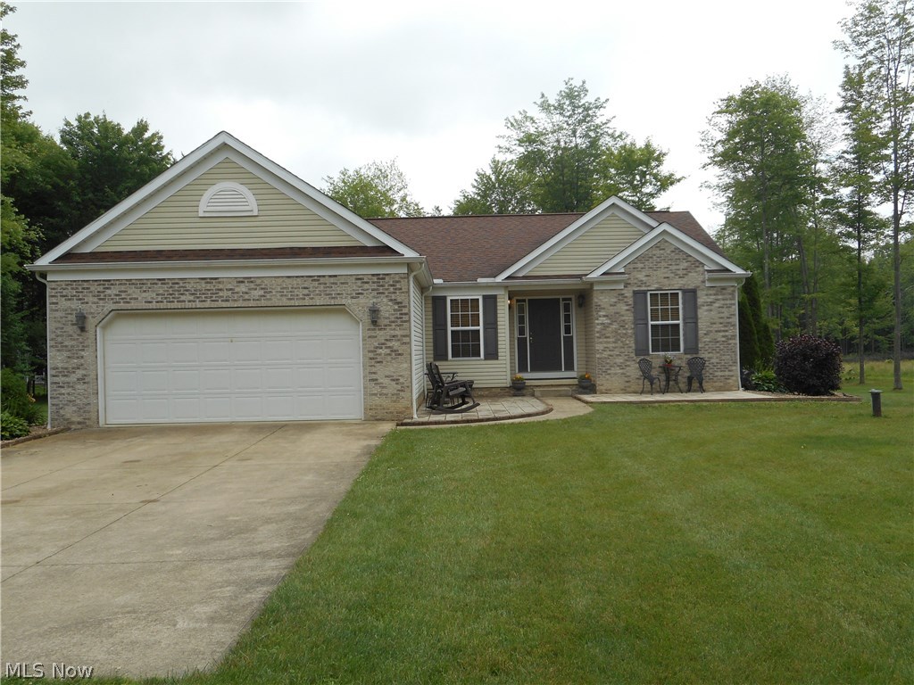 Looking for a peaceful, serene setting? Situated on over 5 acres, this custom built one-owner home offers spacious rooms and an open floor plan! The vaulted great room features a woodburning fireplace, which is open to the vaulted, applianced eat-in kitchen. There's even sliders leading you to a beautiful screened in porch to enjoy your morning coffee watching the sunrise. Three nice sized bedrooms and 2 full baths. The master bedroom/bath offers a huge walk-in closet, jetted tub and walk-in shower. Enjoy the convenient first floor laundry off the garage. Reverse osmosis system for drinking water. Two car insulated garage. Three patios, nicely landscaped. Hot water tank replaced July, 2018. Refrigerator and Microwave (2015). This is a beautiful home on a beautiful property and has been well maintained.