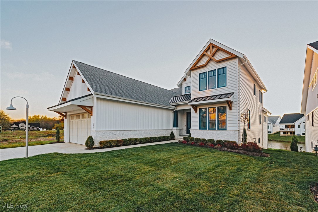 Discover the luxury living in the prestigious Bridgeport community, a distinguished development by Kingdom Home Builders. This brand-new 2-story colonial home boasts 2,823 square feet of thoughtfully designed living space. This home features a spacious layout with three bedrooms, two full bathrooms, and an additional half bath. A designated office space on the main level offers the perfect setting for work or study. Every Kingdom Home is crafted with the finest materials, incorporating cutting-edge smart home technology and modern amenities. This home also showcases a vaulted great room that enhances the open, airy feel of the living spaces. The unique courtyard garage design adds function and style to the home's distinctive character. Located at the highly sought-after corner of Cedar and Lander Roads, Bridgeport is an award-winning community recognized for its exceptional exterior architectural design and commitment to quality. Named Cluster Home Community of the Year by the Home Builders Association of Cleveland, it offers the best of both worlds—luxury and convenience. Residents enjoy quick access to premier shopping, dining, and entertainment, with Legacy Village, Pinecrest, and other renowned retail destinations just moments away. This home is currently under construction, and there is still time to personalize finishes to suit your taste. *Photos are for illustrative purposes only.