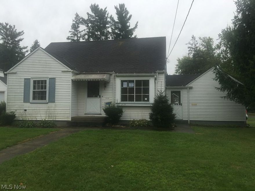 Cute 3 bedroom Cape Cod ...large upstairs bedroom has additional storage areas, eat in kitchen, knotty pine panelled  rec room in basement with bar area and full bath.  enclosed breezeway and attached 1 car garage...located on a corner lot