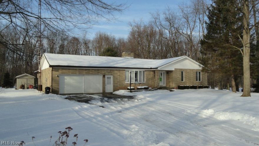 3 bedroom, 2 bath brick ranch on 0.9+/- acre.  Ceramic tile foyer.  Poplar and oak trim throughout.  Brick wood burning fireplace in the dining room with doors to the trex deck.  Kitchen with pantry includes the appliances.  First floor master bedroom includes a full bath with a cherry vanity.  Full basement includes a rec room with built in shelves and a flue for a potential wood burner.  Anderson windows with screens.  Improvements throughout include new asphalt roof and gutters with leaf covers in 2007.  2 car attached garage with a 20 X 21 shop attached with a single overhead door.  Storage shed.  Nearly 1 acre country setting with a screened gazebo and a picnic pavilion.  Taxes reflect the seller receiving a homestead credit of $350.06 annually.