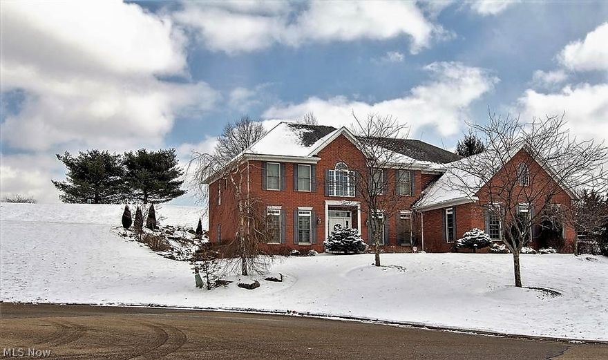 Situated in the prestigious Glenmoor Country Club gated community, this all brick architectural delight was built in 2007 -  w/over 5300sq ft finished space and is perfectly tucked away in a cul de sac on over ½ acre lot with a huge private backyard. The marvelous interior further captivates with three levels of comfort and style touched with essential top notch fixtures and fittings throughout! An elegant two story foyer opens to the formal living and dining rms- study/1st floor guest bedroom/closets & private door to luxury bathroom. Soaring GR with abundance of light leads via column accents to: sunroom w/dr to patio- gourmet kitchen w/eating bar- complementary appliances and dinette- nicely tucked away is the laundry. The 2nd floor by way of two staircases houses the owners suite truly unique with arches –stone pillars and separate lounge to private elevated deck – Oh, and an awesome view of the golf course – the ensuite bath further impresses with a new top of the line shower- cor