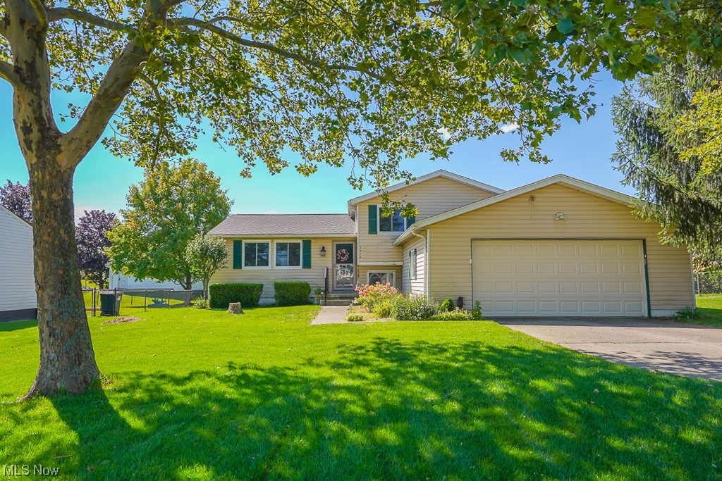 Welcome home to this lovely, well maintained four level split home! First floor layout flows nicely. Spacious living room with nice natural lighting, dining room with slider to back yard. Kitchen located with easy access to dining room! Master bedroom with updated full bath with shower stall. Two additional bedrooms upstairs and additional updated full bath! Lower level has large family room with garage access. Bonus room and powder room also on lower level. Laundry is in basement with plenty of additional storage. This space could also be finished into more living space! Large backyard! Convenient location to highways, shopping and restaurants! This home has only had one owner! Don't miss this opportunity!