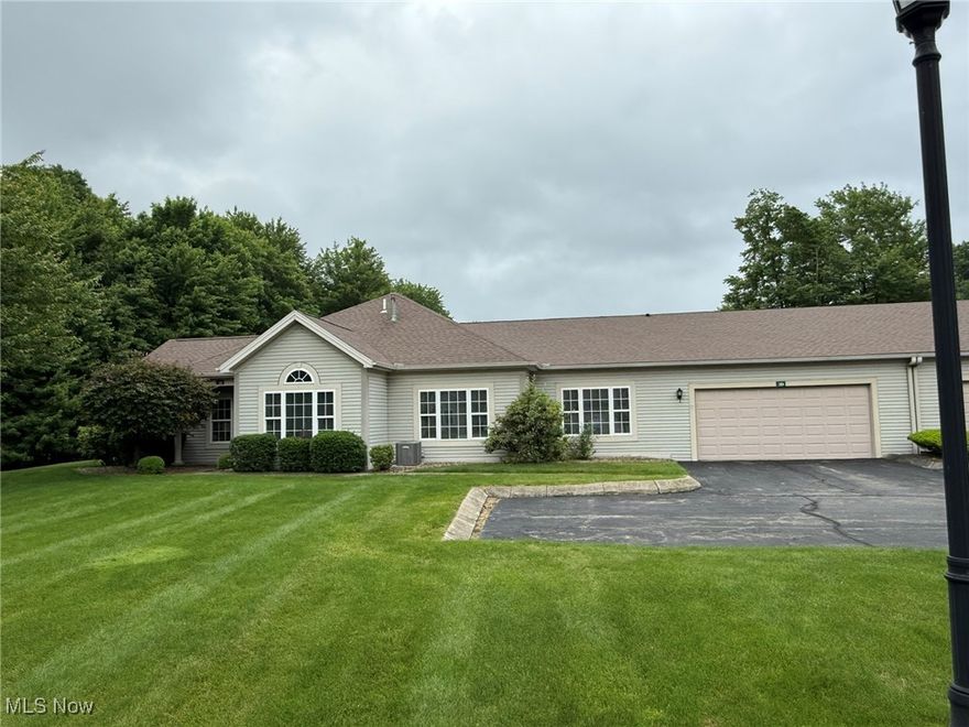 Well maintained, spacious 3 bedroom 3 bathroom condo.  Freshly painted with new light fixtures, laminate floors & 9 foot ceiling throughout. Cathedral ceiling in living room & bedroom/den. Sliding glass door in dining room leading to scenic peaceful patio. White kitchen with raised breakfast bar, panty and stainless steel appliances. Main floor laundry includes utility sink, washer and dryer. Spacious master suite with walk in closet and full bath. 2 additional bedrooms with private baths. 2 car attached garage. Private, end unit in a beautiful gated community that has gorgeous wooded views.  HOA also includes water, sewer, trash, cable, internet lawn maintenance, and snow removal.