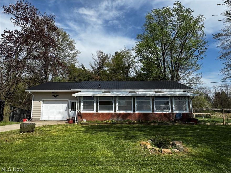 Offering a cozy ranch home on 2.78 acre.  Seller has been busy with updates: 2025: New LVF Flooring, Fresh Paint, New Trim, Roof & AC Unit.  2024: Breaker box updated, updated full bathroom.   Unwind and soak up the sun from the cozy enclosed porch. Inside, the living room flows into a dine-in kitchen with huge pantry.  All appliances are waiting to welcome the new owner.  2 bedrooms with full bathroom complete the first floor.  Full unfinished walkout basement.  There is a half bath set up; no walls at this moment but with a little work could easily be finished.  Laundry hook up with washer & dryer staying.  1 Car attached garage as well outbuilding with lean-to.  Both garages have 220 electric and 110.  Don’t forget about the huge fenced in dog area, fence was installed about a year ago.  This home sure gives you a lot of bang for your buck!