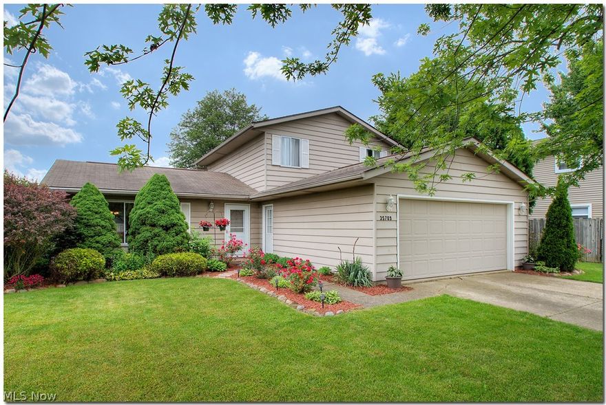 Beautiful spacious split-level with over 1800 sq ft of living space! The main floor features living room with newer carpet and large picture window, fantastic updated kitchen with newer cabinets, granite countertops, tile backsplash and ceramic tiled floors. All kitchen appliances stay. The dining room is located off kitchen with great view of the backyard. Lower level features family room with newer sliding door with leads to entertaining deck with private fenced backyard. Also on lower level is the updated half bath and large laundry room. The second level features three nice bedrooms with full updated bath. Attached two car garage. Don't miss this great home in a highly desired neighborhood!