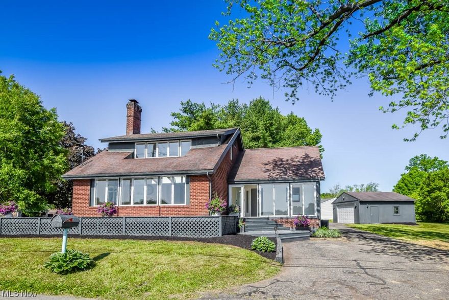 Breathtaking Waterfront Home Overlooking Portage Lake's N Reservoir! The moment you step inside, you'll be greeted by a sunroom entry, complete with sliding patio doors that allow you to bask in the gentle lake breezes. Prepare to be amazed as you enter the grand great room, featuring a gas fireplace, vaulted ceiling, and an entire wall of windows that showcase the amazing lake views. The seamless flow leads to the chef inspired kitchen boasting quartz countertops with bar seating, an under-mount sink, soft close, dovetail cabinetry, and a butler's pantry. Designed with a split bedroom layout for maximum privacy, the master suite features a vaulted beamed ceiling, ambient lighting, and double closets. Indulge in the spa-like full bath, complete with a double sink vanity, corner shower, and a deep soaking tub. The master also provides private access to the deck, an idyllic spot for a hot tub. On the opposite side of the home, you'll find two more bedrooms. One of them boasts a walk-in c