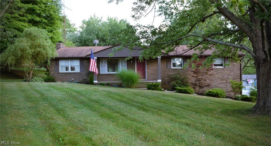 This home is a must see! Nestled on roughly a half acre, this 1,624 sq. ft. 3 bedroom, 2 bath home provides an amazing open floor plan main living space that keeps the family connected. The living room, kitchen and dining areas are all open to each other, giving an open, spacious feel. You will be sure to fall in love with the interior architectural elements and finishing details that this home offers. Fantastic updates have been made throughout this home. The gourmet kitchen has updated cabinets, butcher block countertops, tile backsplash, and a party starter island that is ideal for entertaining. Gorgeous Mannington laminate flooring is present throughout the main living area offering durability for a family with children or four legged friends. The cozy hearth room has a charming wood burning fireplace. The main bath has recently been completely remodeled. The large sunroom features exposed wood beams and leads directly to a huge deck. The private back yard has a fire pit/sitting ar