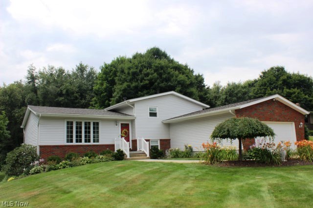 Picture perfect inside & out! Beautiful 3-4 bedroom, 2 bath, 4 level split w/1779SF, neutral décor thru out with so many high end improvements* Situated on private .74 acre lot* Entry w/ceramic floor which leads to outstanding updated eat in kitchen w/stainless appliances, brushed white wash maple cabinets w/roll out shelves, Corian countertop, stone & glass backsplash & ceramic floor* Living room with newer Pella windows* Formal dining w/slider to vinyl deck* Oak steps to second level w/updated bath & 3 bedrooms w/ceiling fans* Oak steps down to spacious rec room w/wainscoting, Pella door to patio, office or 4th bedroom and full updated bath* Updates include 6 panel oak doors, updated woodwork, windows, vinyl exterior, gutter guard, roof (2007), furnace 2006, A/C 2008, pressure tank 2007, and well 2005* Lovely .74 acre lot w/creek* 12x16 storage building* Vinyl deck* Patio* Generous 2 car garage* Absolute move in condition*