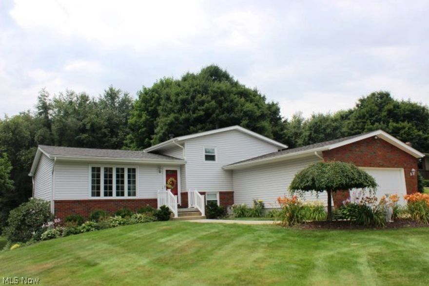 Picture perfect inside & out! Beautiful 3-4 bedroom, 2 bath, 4 level split w/1779SF, neutral décor thru out with so many high end improvements* Situated on private .74 acre lot* Entry w/ceramic floor which leads to outstanding updated eat in kitchen w/stainless appliances, brushed white wash maple cabinets w/roll out shelves, Corian countertop, stone & glass backsplash & ceramic floor* Living room with newer Pella windows* Formal dining w/slider to vinyl deck* Oak steps to second level w/updated bath & 3 bedrooms w/ceiling fans* Oak steps down to spacious rec room w/wainscoting, Pella door to patio, office or 4th bedroom and full updated bath* Updates include 6 panel oak doors, updated woodwork, windows, vinyl exterior, gutter guard, roof (2007), furnace 2006, A/C 2008, pressure tank 2007, and well 2005* Lovely .74 acre lot w/creek* 12x16 storage building* Vinyl deck* Patio* Generous 2 car garage* Absolute move in condition*